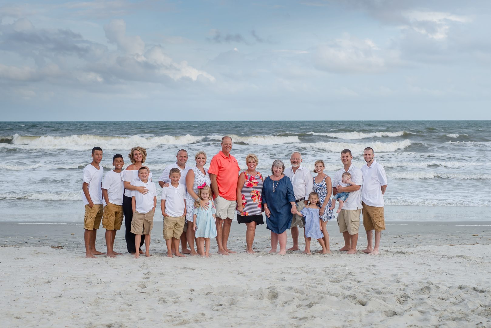 A large family by the ocean on Kure Beach, NC.